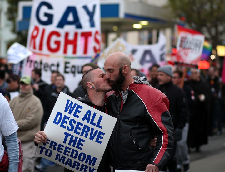 SAN FRANCISCO, CA - MARCH 25: A same-sex couple kisses as they march during a rally in support of marriage equality on March 25, 2013 in San Francisco, California. Supporters of same-sex marriage held a rally and are set to march through San Francisco a day before the U.S. Supreme Court will hear arguments on California's Proposition 8, the controversial ballot initiative that defines marriage as between a man and a woman. (Photo by Justin Sullivan/Getty Images)