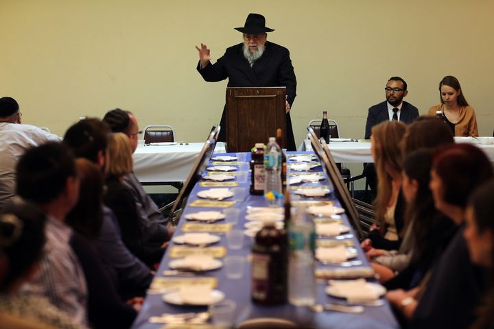 MIAMI BEACH, FL - MARCH 25: Rabbi Efraim Katz leads a community Passover Seder at Beth Israel synagogue on March 25, 2013 in Miami Beach, Florida. The community Passover Seder that served around 150 people has been held for the past 30 years and is welcome to anyone in the community that wants to commemorate the emancipation of the Israelites from slavery in ancient Egypt. (Photo by Joe Raedle/Getty Images)