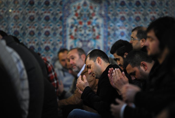 A muslim worshippers pray in the mosque in downtown Sofia on April 5, 2013. Bulgaria is hoping to stop protest-driven suicides, including self-immolations, that have swept the country in recent weeks by organising prayers for all faiths and free psychological counselling. Religious leaders from the Christian Orthodox, Catholic, Armenian and Protestant churches, as well as Muslim and Jewish leaders, agreed Thursday to hold prayers all over the country this weekend following an initiative by President Rosen Plevneliev. AFP PHOTO / NIKOLAY DOYCHINOV (Photo credit should read NIKOLAY DOYCHINOV/AFP/Getty Images)