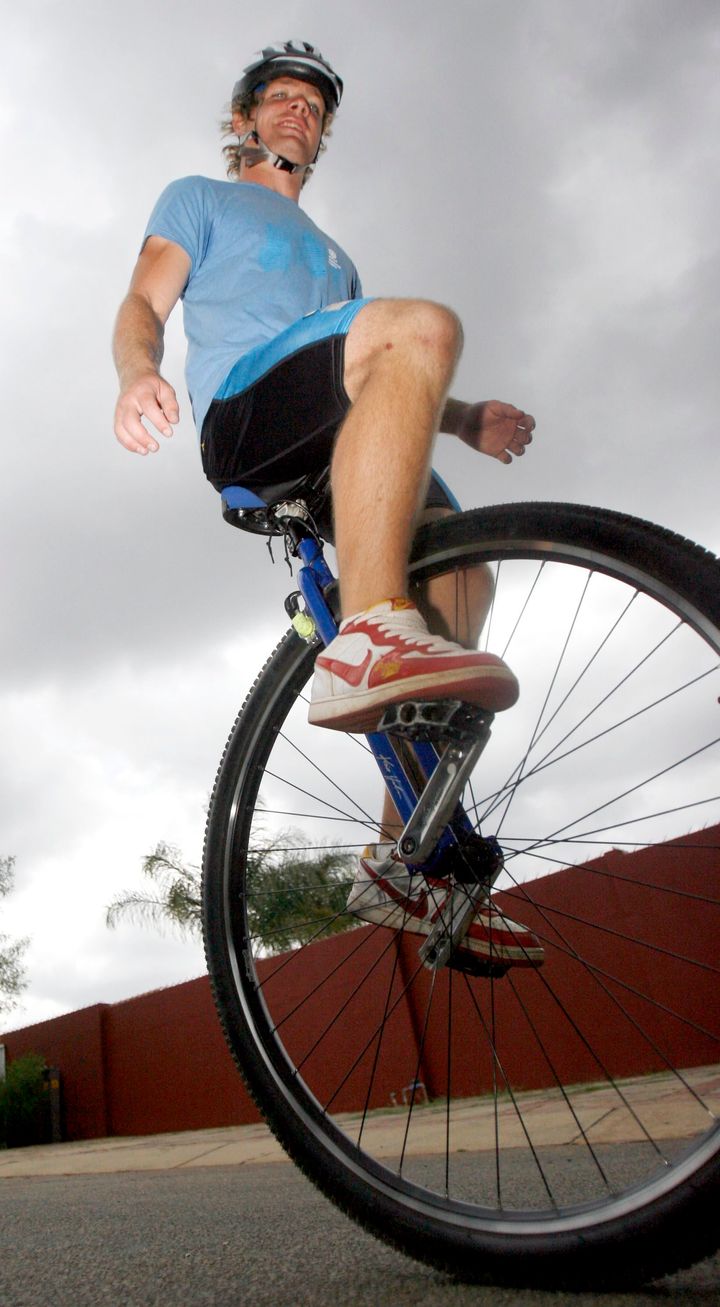 PRETORIA, SOUTH AFRICA - DECEMBER 8: (SOUTH AFRICA, UAE, BRAZIL OUT) Christo Coetzer, a student at the University of Pretoria, poses on his unicycle on December 8, 2009 in Pretoria, South Africa. Coetzer will depart for Mauritius on Friday where he will cycle around the island, on a unicycle, in 10 to 14 days attempting to set a new world record. He will be cycling along the coastline, which is approximately 177km. Coetzer has been corresponding with Guinness World Records and has found out that no record similar to what he is attempting, has been set. (Photo by Foto24/Gallo Images/Getty Images)