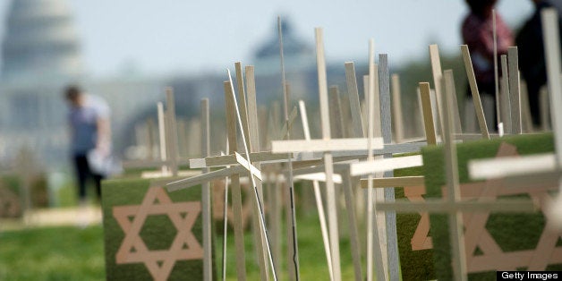 UNITED STATES - APRIL 11: Members of Newtown, Ct. clergy have set up more than 3,300 grave markers on the Mall during a 24-hour vigil to support the gun violence legislation now on the floor of the Senate.(Photo By Chris Maddaloni/CQ Roll Call)