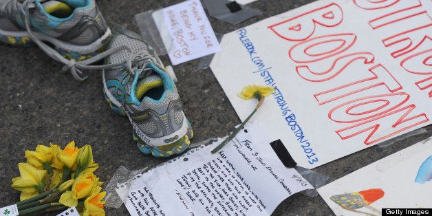 BOSTON - APRIL 18: Letters, running shoes, posters and flowers line the impromptu memorial at the corner of Boylston and Berkeley Streets for the victims of the bombing at the 117th Boston Marathon, April 18, 2013. (Photo by Essdras M Suarez/The Boston Globe via Getty Images)