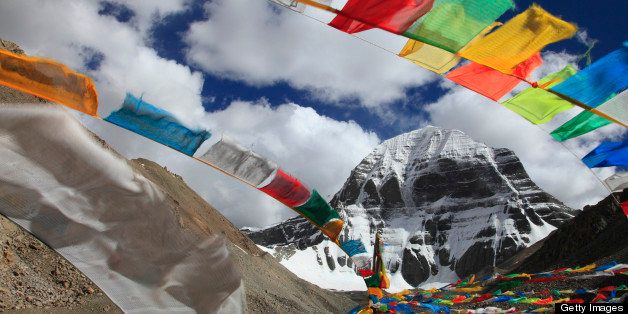 Mt.Kailash is the most sacred mountain in Tibet. Many Buddhist prayer flags flutters front of mountain. 