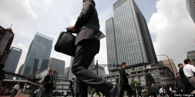 Morning commuters make their way to work in Tokyo, Japan, on Tuesday, May 29, 2012. Japan's jobless rate unexpectedly rose and retail sales fell for a second month, underscoring concern that an economic recovery will lose momentum in the face of gains in the yen and Europe's debt crisis. Photographer: Tomohiro Ohsumi/Bloomberg via Getty Images 