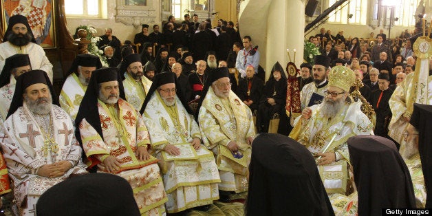 (FILES) -- A file picture taken on February 10, 2013 shows Syrian Bishop Boulos Yaziji (seated-L), head of the Greek Orthodox church in Aleppo, during the enthroanment in Damascus of his brother Yuhanna X Yazigi (seated-R) as the Patriarch of Antioch. An armed group kidnapped two bishops in a village in Aleppo province in northern Syria, the state news agency SANA reported late on April 22, 2103, including Bishop Boulos and Bishop Yuhanna Ibrahim, head of the Syriac Orthodox Church in Aleppo. AFP PHOTO / LOUAI BESHARA (Photo credit should read LOUAI BESHARA/AFP/Getty Images)