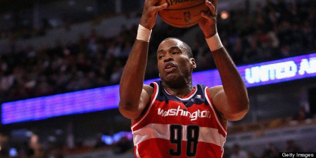 CHICAGO, IL - APRIL 17: Jason Collins #98 of the Washington Wizards rebounds against the Chicago Bulls at the United Center on April 17, 2013 in Chicago, Illinois. The Bulls defeated the Wizards 95-92. NOTE TO USER: User expressly acknowledges and agrees that, by downloading and or using this photograph, User is consenting to the terms and conditions of the Getty Images License Agreement. (Photo by Jonathan Daniel/Getty Images) 