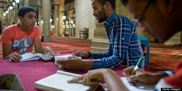 CAIRO, EGYPT - NOVEMBER 10: From left, students Yosef Ali, Mostafa Mohammed, and Saleh Ahmed study together in Al-Azhar Mosque on November 10, 2012 in the Islamic neighborhood of Cairo, Egypt. Al-Azhar University, as a center for Islamic learning and higher education and the study of Arabic literature, has become one of the oldest running universities in the world. Al-Azhar is attempting to remain independent despite pressure from political groups, the government and the Islamist movement. (Photo by Ann Hermes/The Christian Science Monitor via Getty Images)