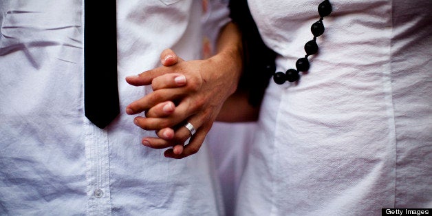 TEL AVIV, ISRAEL - JULY 25: (ISRAEL OUT) Bride Yulia Tagil and grome Stas Granin hold hands during their alternative wedding