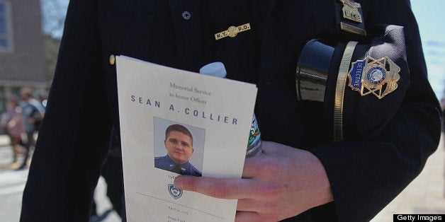 CAMBRIDGE, MA - APRIL 24: Norwalk, NY Police Officer Kerry Market was one of thousands who attended the memorial service for slain MIT Police Officer Sean Collier, at Briggs Field in Cambridge, Wednesday, April 24, 2013. Collier was killed during a shootout with the Boston Marathon bombing suspects. (Photo by Wendy Maeda/The Boston Globe via Getty Images)