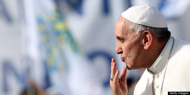 VATICAN CITY, VATICAN - MAY 18: Pope Francis waves to faithful as he arrives in St. Peter's Square for the celebration of Pentecost Vigil with lay Ecclesial movements on May 18, 2013 in Vatican City, Vatican. This weekend tens of thousands of people descend on the Vatican to celebrate the Pentecost Vigil together with Pope Francis. Echoing similar celebrations that took place with his predecessors Blessed John Paul II and Benedict XVI, the Holy Father has called the New Movements and Ecclesial Communities to invoke the Holy Spirit upon them and their continued mission in the life of the Church. (Photo by Franco Origlia/Getty Images)