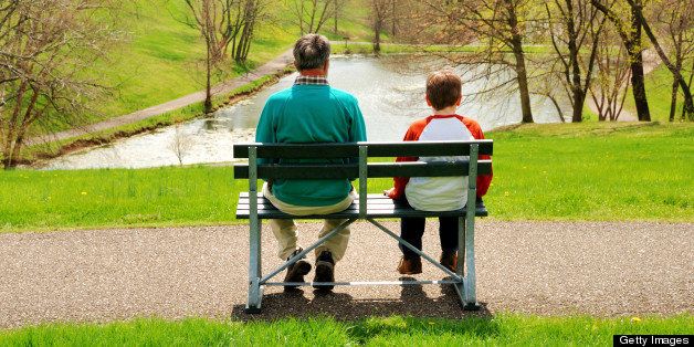 Man and boy on park bench