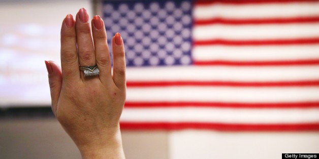 NEW YORK, NY - MAY 17: An immigrant takes the oath of citizenship to the United States at a naturalization ceremony held at the U.S. Citizenship and Immigration Services (USCIS), office on May 17, 2013 in New York City. One hundred and fifty immigrants from 38 different countries became U.S. citizens at the event. Some 11 million undocumented immigrants living in the U.S. stand to eventually gain American citizenship if Congress passes immigration reforms currently being negotiated in Washington D.C. (Photo by John Moore/Getty Images)