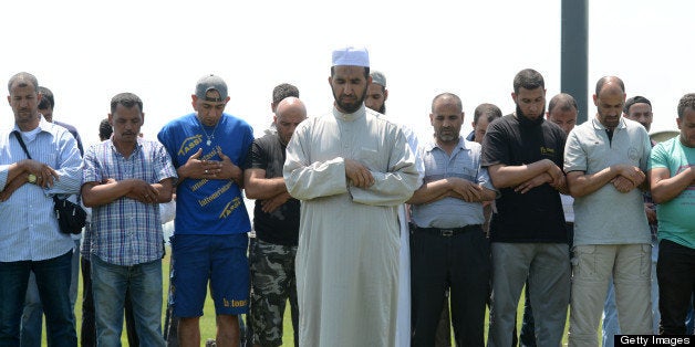 Muslim workers pray after colleagues were killed during an earthquake on May 29, 2012 in a factory in Medolla. As many as 10 people were reported killed when a strong earthquake rocked northeastern Italy on Tuesday, just days after another quake in the same region wrought death and destruction. AFP PHOTO / ALBERTO LINGRIA (Photo credit should read ALBERTO LINGRIA/AFP/GettyImages)