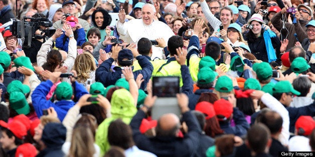 VATICAN CITY, VATICAN - MAY 29: Pope Francis arrives in St. Peter's Square for his weekly audience on May 29, 2013 in Vatican City, Vatican. The Pontiff began his catechesis, which this week began a new series of reflections on the mystery of the Church, based in the documents of the II Vatican Council. (Photo by Franco Origlia/Getty Images)