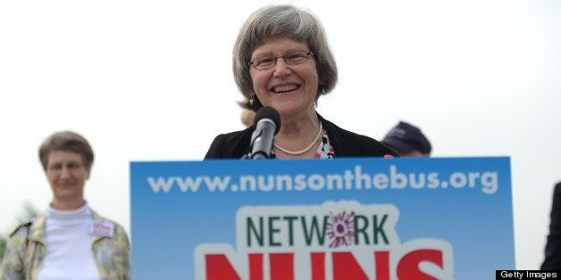 Sister Simone Campbell, executive director of NETWORK, a National Catholic social justice lobby, launches the ?Nuns on the Bus? bus tour to promote immigration reforms, in Jersey City, New Jersey, May 29, 2013. Sister Simone and 25 other nuns will hit the road for a 6,500-mile, 15-state tour to raise their voices for bipartisan, immigration reform. The trip starts from across from Ellis Island at Liberty State Park in New Jersey on May 29, 2013 and will conclude with a rally in the shadow of San Francisco?s Angel Island on June 18, 2013. AFP PHOTO/Emmanuel Dunand (Photo credit should read EMMANUEL DUNAND/AFP/Getty Images)