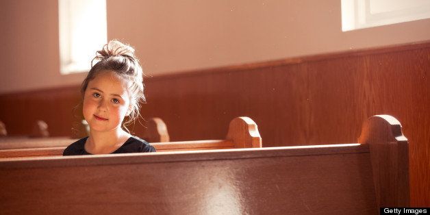 This is a portrait of an 8 year old preacher's daughter bathed in the warm light coming through the church windows on a Sunday evening. Oak pews and paneling add a warm glow, and a few dust motes in the air complete the atmosphere.