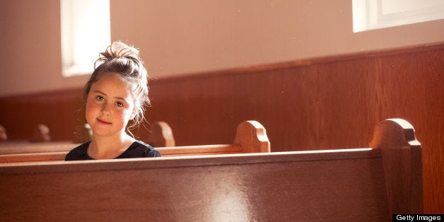 This is a portrait of an 8 year old preacher's daughter bathed in the warm light coming through the church windows on a Sunda