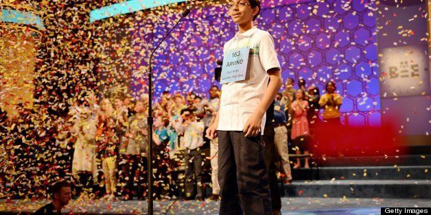 Scripps National Spelling Bee winner Arvind Mahankali of Bayside Hills, New York, stands under a shower of confetti after he spelled 'knaidel' to win this year's Bee in National Harbor, Maryland, Thursday, May 30, 2013. (Chuck Myers/MCT via Getty Images)