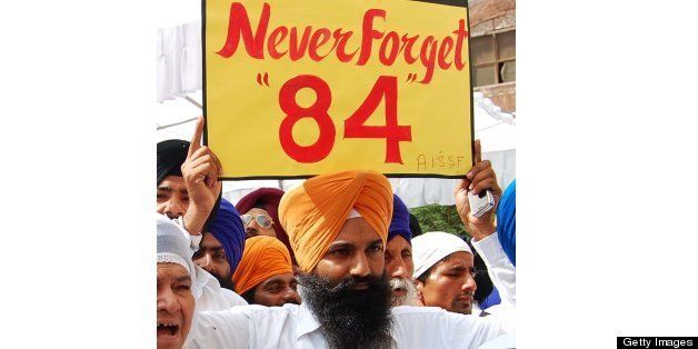 Activists from a radical Sikh organisation holds placards in support of Sikh leader Sant Jarnail Singh Bhindranwale and Khalistan, the name given for an envisioned independent Sikh state, after prayers at the Golden Temple in Amritsar on June 6, 2011. 'Ghallughara Diwas' is the anniversary of the deadly 1984 Indian army 'Operation Bluestar' assault on the Golden Temple complex to arrest Sant Jarnail Singh Bhindranwale, a Sikh leader and his militant followers who had initiated a movement for a separate Sikh state. AFP PHOTO/NARINDER NANU (Photo credit should read NARINDER NANU/AFP/Getty Images)
