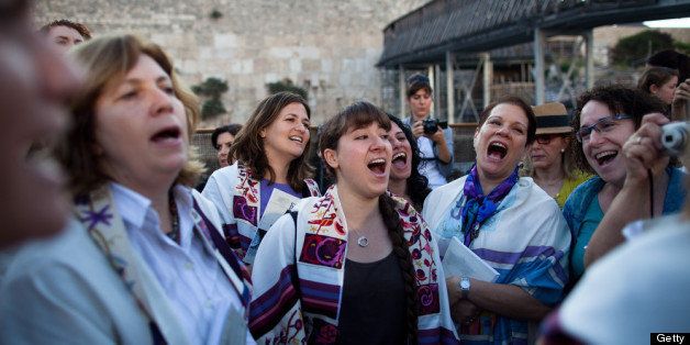 JERUSALEM, ISRAEL - MAY 10: Members of the religious group 'Women Of The Wall' hold a prayer service to mark the first day of the Jewish month of Sivan at the Western Wall on May 10, 2013 in Jerusalem, Israel. Thousands of ultra-Orthodox protestors clashed with Israeli police during the first monthly prayer service to be held by Women Of The Wall following the recent landmark ruling by Jerusalem District Court allowing women to wear prayer shawls at the Western Wall. (Photo by Uriel Sinai/Getty Images)