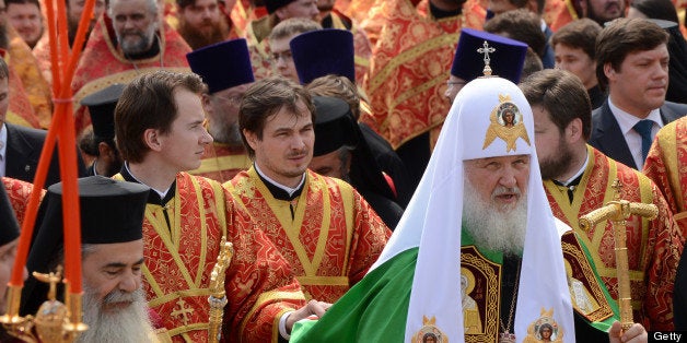 Russian Orthodox Patriarch Kirill (front R) takes part in a religious procession marking Saints Cyrilius and Methodius' Day i