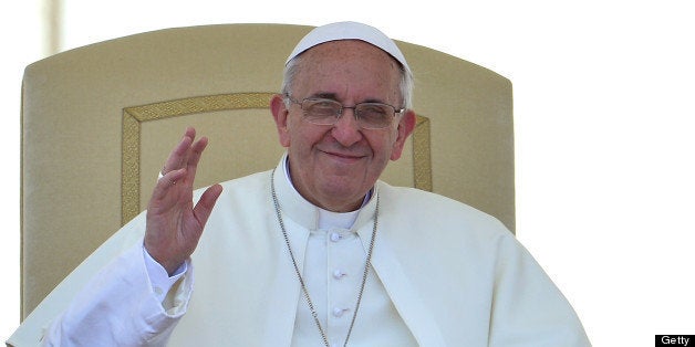 Pope Francis waves to faithfuls gathered in St Peter's square at the Vatican on June 12, 2013 for his weekly general audience. AFP PHOTO / ALBERTO PIZZOLI (Photo credit should read ALBERTO PIZZOLI/AFP/Getty Images)