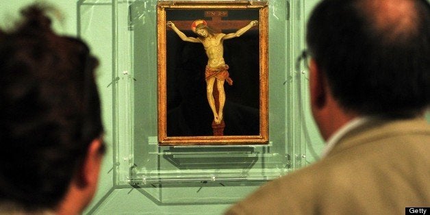 Visitors look at 'Crucifixion' by 15th century master Filippino Lippi during the 'Filippino Lippi and Sandro Boticelli nella
