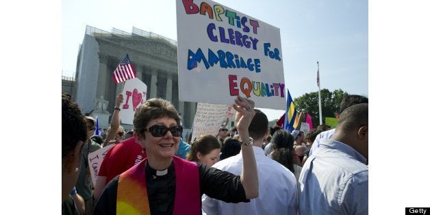 UNITED STATES - June 26 : Gay and lesbian activist protest in front of the U.S. Supreme Court building on June 26, 2013 in Washington, DC. The protest turned to celebration when the high court ruled that married gay and lesbian couples are entitled to federal benefits, making the ruling a major victory for the gay rights movement. (Photo By Douglas Graham/CQ Roll Call)