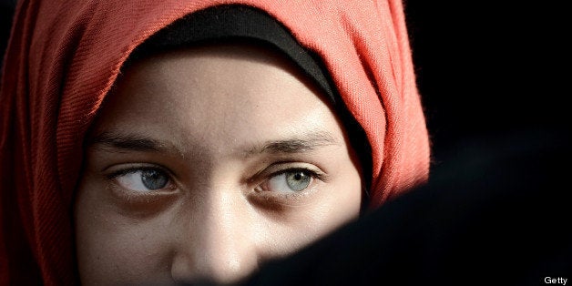 A young Bahraini girl attends an anti-government rally to support Bahraini top senior Shiite cleric, Sheikh Isa Qassim, in th