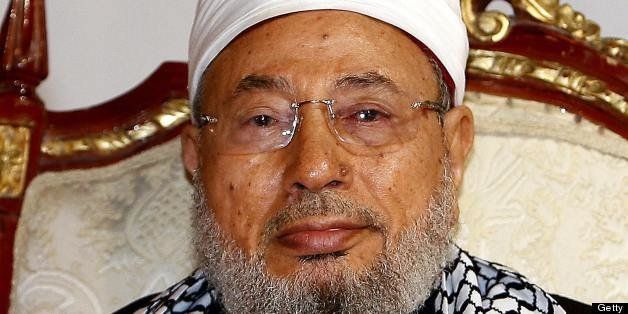 Qatar's Egyptian-born cleric Sheikh Youssef al-Qaradawi attends a protest against Israel over the recent Israeli attacks on the Gaza Strip, at the Qatar Sports Club in Doha, on January 1, 2009. Israel killed a Hamas leader today in the biggest blow yet to the Islamist group's command structure as dozens more air strikes on Gaza took the death toll from the six-day blitz to at least 420. AFP PHOTO/KARIM JAAFAR (Photo credit should read KARIM JAAFAR/AFP/Getty Images)