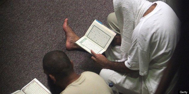 Cooperative detainees in communal detention conduct prayers during Ramadan at the U.S. Navy base at Guantanamo Bay, Cuba on Monday, August 6, 2012. (Walter Michot/Miami Herald/MCT via Getty Images)