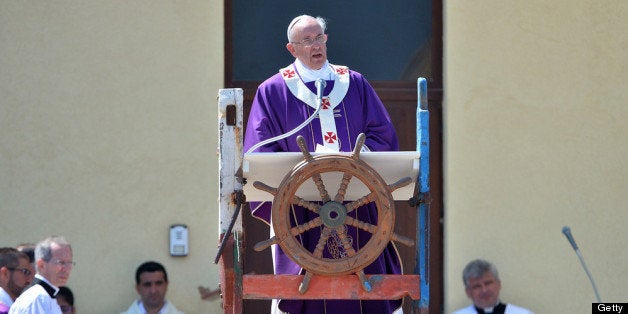 LAMPEDUSA, ITALY - JULY 08: Pope Francis celebrates Holy Mass during his visit to the island of Lampedusa on July 8, 2013 in Italy. On his first official trip outside Rome, Pope Francis arriving at Lampedusa airport, before boarding a boat to make the crossing to the island. He was accompanied by fishermen in their own boats as he he layed a wreath on the sea in memory of migrants who have lost their lives in the crossing to the island from Africa. He met with a group of migrants at the pier and held mass. (Photo by Tullio M. Puglia/Getty Images)