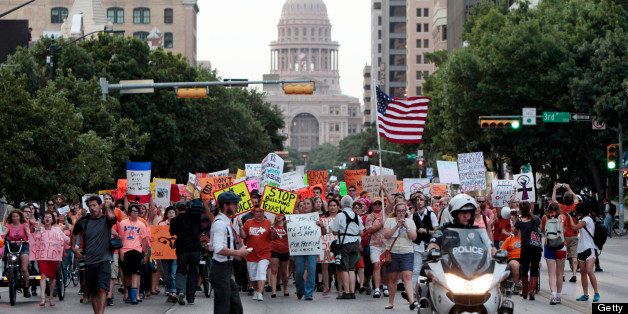 AUSTIN, TX - JULY 08: Pro-choice protesters march down Congress Avenue and back to the Texas state capitol as pro-life supporters and pro-choice protesters rally at the Texas state capitol in favor and against the new controversial abortion legislation up for a vote in the state legislature, on July 8, 2013 in Austin Texas. Texas Gov. Rick Perry called on a second legislative special session to pass an restrictive abortion law through the Texas legislature. The first attempt was defeated after opponents of the law were able to stall the vote until after first special session had ended. (Photo by Erich Schlegel/Getty Images)
