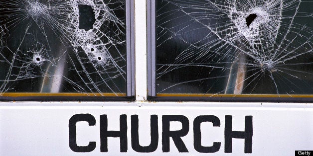 Bullet holes in window of church