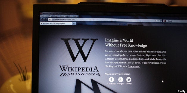 LONDON, ENGLAND - JANUARY 18: A laptop computer displays Wikipedia's front page showing a darkened logo on January 18, 2012 in London, England. The Wikipedia website has shut down it's English language service for 24 hours in protest over the US anti-piracy laws. (Photo by Peter Macdiarmid/Getty Images)