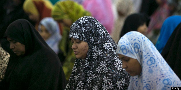 COLOMBO, SRI LANKA - JULY 10: Muslim women and children attend a special evening Ramadan prayer at the Juma Masjid July 10, 2013 in Colombo, Sri Lanka. The ninth month of the Islamic calendar is observed as a month of fasting by Muslims across the globe. In Sri Lanka there are three distinct groups making up the Muslim community; the Sri Lankan Moors, the Indian Muslims and the Malays. Women in Sri Lanka are under pressure by the Budhist activist group, the Bodu Bala Sena to not wear the wear the traditional niqab. (Photo by Paula Bronstein/Getty Images)