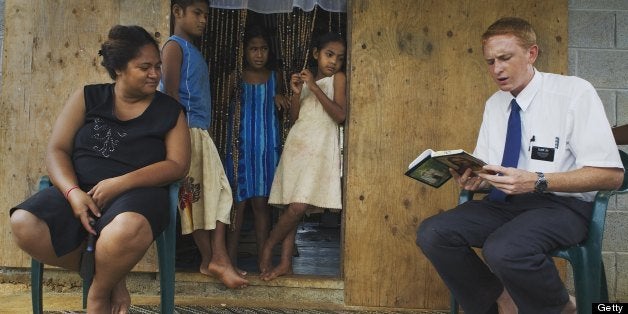 VAVA'U, TONGA - APRIL 19: Elder Liki from Utah, visits and reads religious writings to villagers in Ha'alaufuli Village on April 19, 2007 in the Vava'u island group of Tonga. These visits are part of his two-year proselytizing and missionary work in Tonga for the Mormon Church of Jesus Christ of Latter-Day Saints. The Mormon Church has been in Tonga for over hundred years, arriving when many Christian missionaries came to Tonga to convert the population to Christianity. Tonga is one of the last surviving monarchies in the Pacific islands, however there has been a recent push towards democratic reform, challenging the people of Tonga to maintain their cultural heritage while conforming to modern day capitalism. (Photo by Amy Toensing/Getty Images)