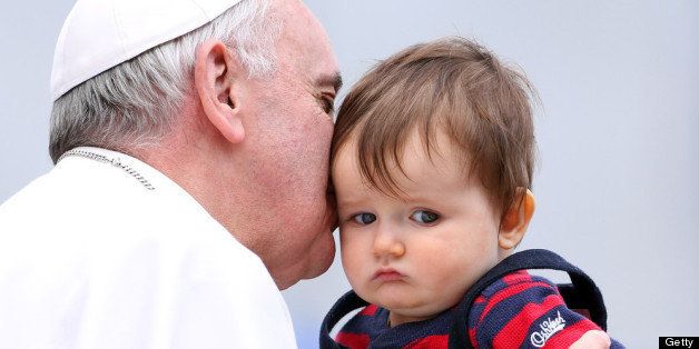 VATICAN CITY, VATICAN - APRIL 03: Pope Francis kisses Johnny Oliver Sueeney an American baby from Virginia as he leaves St. Peter's square at the end of his weekly audience on April 3, 2013 in Vatican City, Vatican. Pope Francis delivered his catechism to a crowd of approximately 30,000 pilgrims packed into St Peter's Square. (Photo by Franco Origlia/Getty Images)