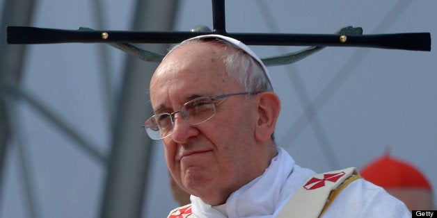 Pope Francis celebrates the last mass of his visit to Brazil, at Copacabana beach in Rio de Janeiro, on July 28, 2013. Throngs of pilgrims attending WYD spent the night sleeping on the beach before Sunday's final mass, while the city's mayor said he expects up to three million people to pack the beach for the occasion. AFP PHOTO / POOL - LUCA ZENNARO (Photo credit should read LUCA ZENNARO/AFP/Getty Images)