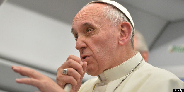 Pope Francis speaks during a long press conference held aboard the papal flight on their way back to Italy upon departure fro