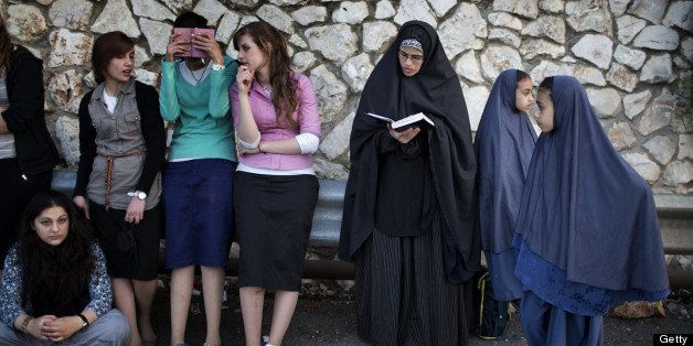 Ultra-Orthodox Jewish women pray during a ceremony at the grave site of Rabbi Shimon Bar Yochai in the northern Israeli village of Meron on April 28, 2013 at the start of the day-long holiday of Lag Baomer that commemorates the Jewish scholar's death. Thousands of religious Jews light large bonfires all night long and visit the shrine of Bar Yochai, one of the most prominent sages in Jewish history, during the holiday. AFP PHOTO/MENAHEM KAHANA (Photo credit should read MENAHEM KAHANA/AFP/Getty Images)