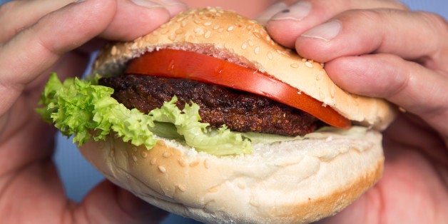 A beef burger created by stem cells harvested from a living cow is held for a photograph by Mark Post, a Dutch scientist, following a Bloomberg Television interview in London, U.K., on Tuesday, Aug. 6, 2013. The 5-ounce burger, which cost more than 250,000 euros ($332,000) to produce, was developed by Post of Maastricht University with funding from Google co-founder Sergey Brin. Photographer: Simon Dawson/Bloomberg via Getty Images