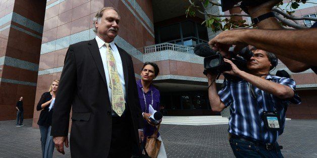 Lawyer Steven Seiden (L), defending Mark Basseley Youssef, who previously went by the name Nakoula Basseley Nakoula, walks away after briefing the media outside a courthouse in Los Angeles, on October 10, 2012 in California. The alleged filmmaker behind 'Innocence of Muslims' was falsely accused of sparking violence that killed the US envoy to Libya, his defense team said, ahead of a new court hearing. The the latest details on the Benghazi attack showed that reports blaming his anti-Islamic film for Middle East unrest were unfounded, a spokesman for Seiden said. AFP PHOTO / Frederic J. BROWN (Photo credit should read FREDERIC J. BROWN/AFP/GettyImages)
