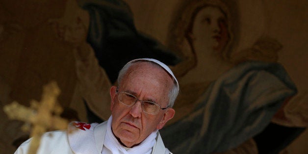 Pope Francis celebrates the Assumption Day mass in the Castelgandolfo's central square on August 15, 2013. AFP PHOTO / POOL/ ALESSANDRO BIANCHI (Photo credit should read ALESSANDRO BIANCHI/AFP/Getty Images)