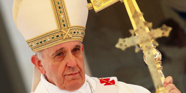 Pope Francis celebrates the Assumption Day mass in the Castelgandolfo's central square on August 15, 2013. AFP PHOTO / PO