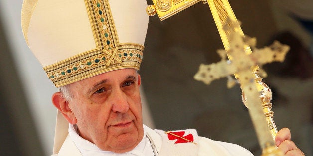 Pope Francis celebrates the Assumption Day mass in the Castelgandolfo's central square on August 15, 2013. AFP PHOTO / POOL/ ALESSANDRO BIANCHI (Photo credit should read ALESSANDRO BIANCHI/AFP/Getty Images)