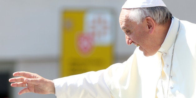 VATICAN CITY, VATICAN - JUNE 26: Pope Francis waves to the faithful as he arrives in the Popemobile in St. Peter's Square for his weekly audience on June 26, 2013 in Vatican City, Vatican. In his catechetical remarks, the Holy Father concentrated on the image of the Church as living temple and People of God. (Photo by Franco Origlia/Getty Images)