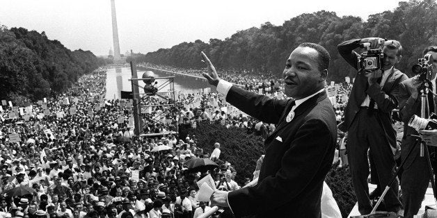 The civil rights leader Martin Luther KIng (C) waves to supporters 28 August 1963 on the Mall in Washington DC (Washington Monument in background) during the 'March on Washington'. King said the march was 'the greatest demonstration of freedom in the history of the United States.' Martin Luther King was assassinated on 04 April 1968 in Memphis, Tennessee. James Earl Ray confessed to shooting King and was sentenced to 99 years in prison. King's killing sent shock waves through American society at the time, and is still regarded as a landmark event in recent US history. AFP PHOTO (Photo credit should read -/AFP/Getty Images)