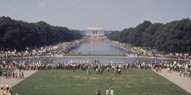 Elevated view of participants surrounding the Lincoln Memorial Reflecting Pool during the March on Washington for Jobs and Freedom, Washington DC, August 28, 1963. The march provided the setting for Dr. Martin Luther King Jr's iconic 'I Have a Dream' speech. The Lincoln Memorial is visible in the distance. (Photo by John Dominis/Time & Life Pictures/Getty Images)