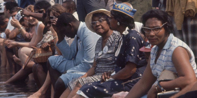 View of participants as they cool their feet in the Lincoln Memorial Reflecting Pool during the March on Washington for Jobs and Freedom, Washington DC, August 28, 1963. The march provided the setting for Dr. Martin Luther King Jr's iconic 'I Have a Dream' speech. (Photo by Paul Schutzer/Time & Life Pictures/Getty Images)